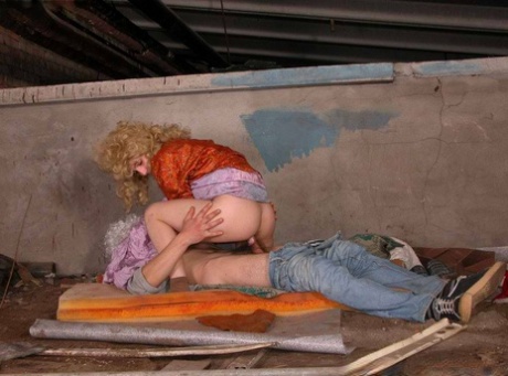 Homeless couple have sex in a sheltered location while wearing wigs