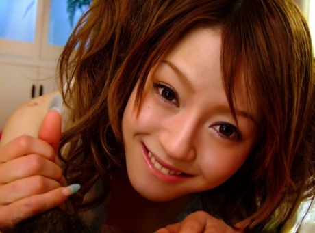 Japanese cutie sports a palmful of sperm after blowing a tiny cock in POV mode 33039707